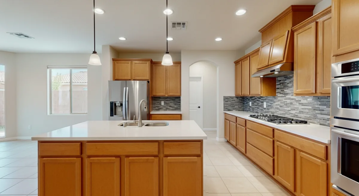 Kitchen cabinetry, island, and countertop detail